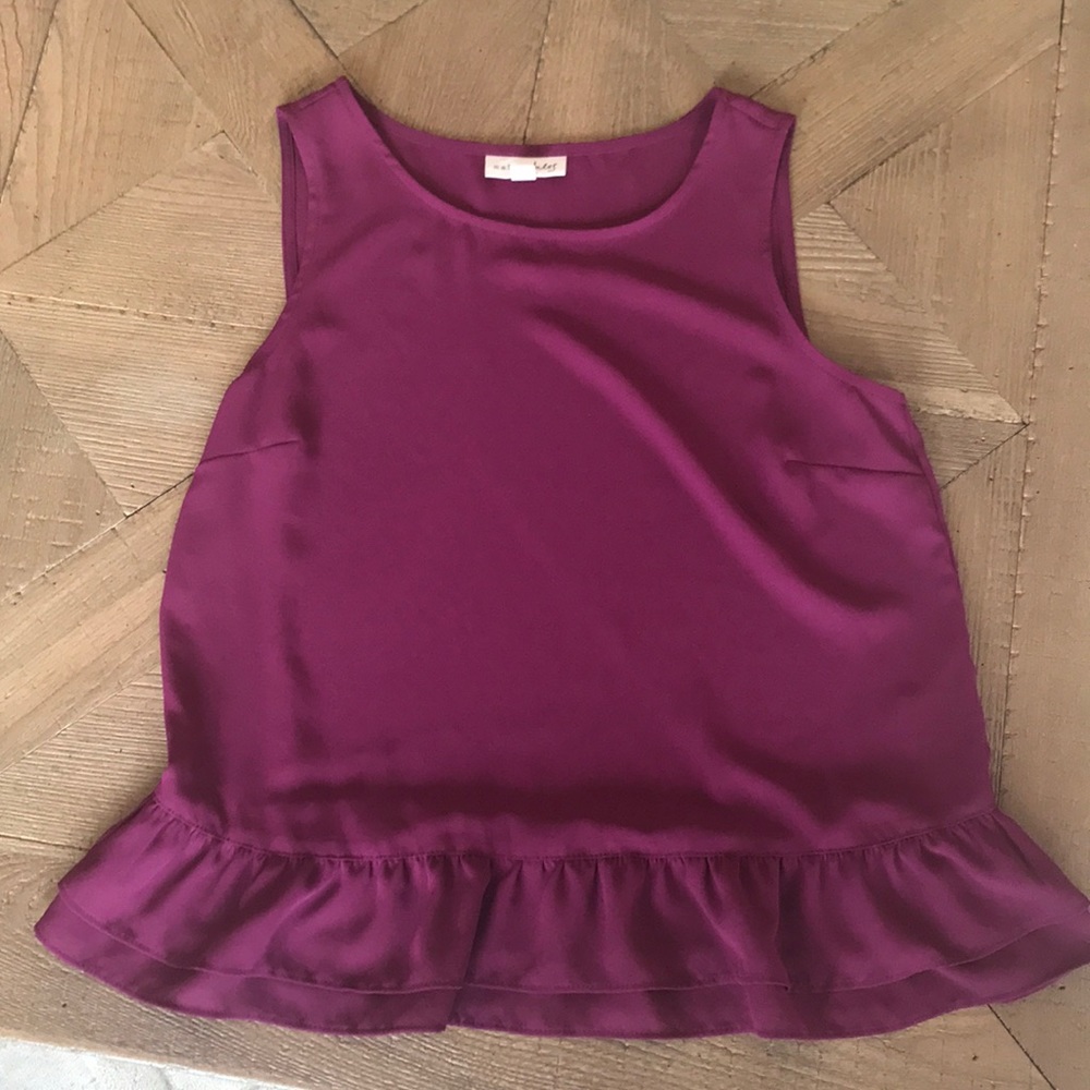Sleeveless top with ruffled bottom